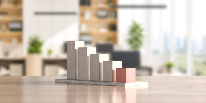 Wooden ascending block bar chart on tabletop in blurred office for business growth presentation and financial concept background