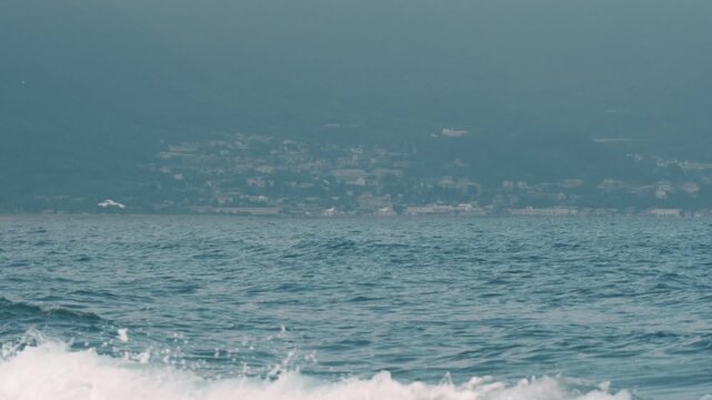 Distant Cityscape Across the Bay Viewed from an Inlet