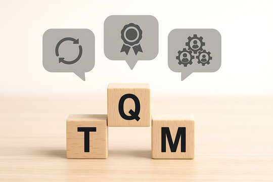 Wooden blocks spelling tqm with circular refresh award and gear icons above