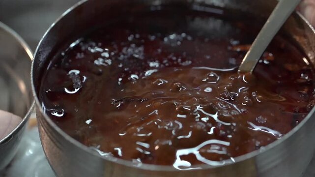 Extreme close up shot of freshly cooked Dal Tadka highlighting its rich texture and aromatic tempering.