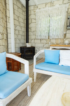 Cozy indoor seating area with stove and soft cushions