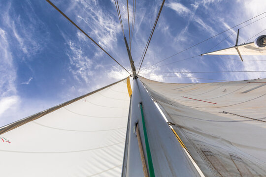 View from below of a majestic sail against the sky