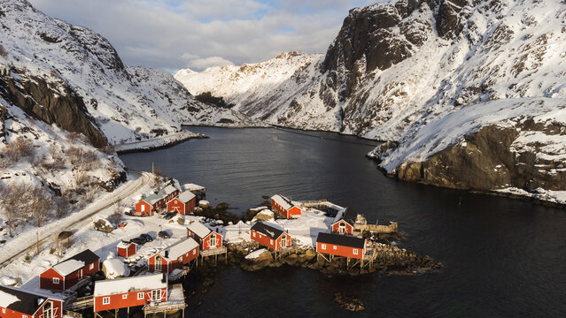 Red cabins in wintery Lofoten Island landscape