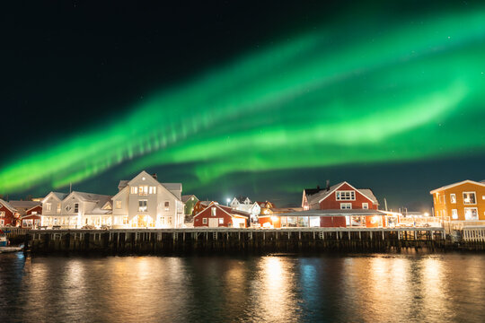Aurora illuminates Lofoten Islands village in winter