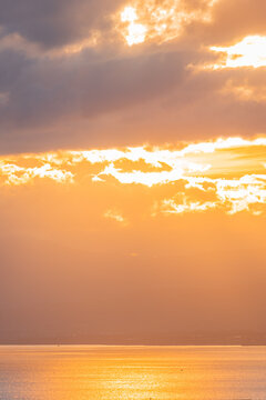 Golden sunset over Lake Geneva with dramatic clouds