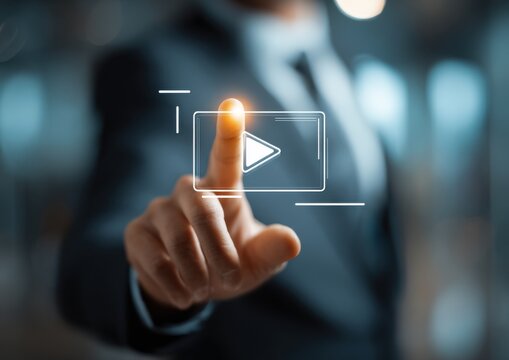 Executive hand touching a floating virtual play button icon for streaming media and interactive content with streaming interface interaction business technology hologram multimedia activation