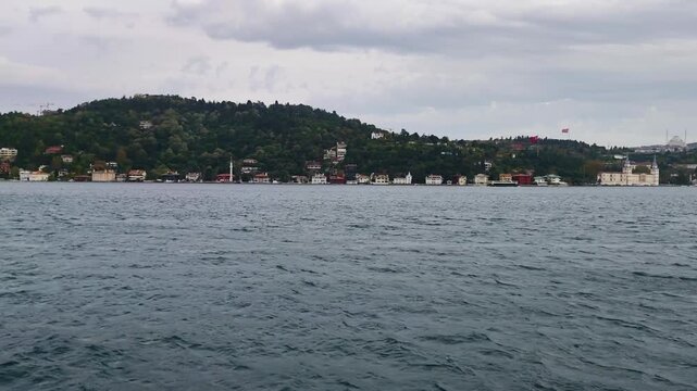 Beautiful Daytime View of Istanbul Bosphorus Strait Asian Coast with Historic Kuleli Military High School Building, Waterfront Houses and Green Hillside under Cloudy Sky, Turkey Footage