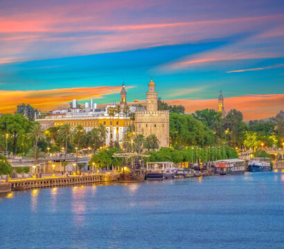Dusk over  the old city center of Seville, featuing the Torre del Oro tower,  Seville, Andalusia, Spain
