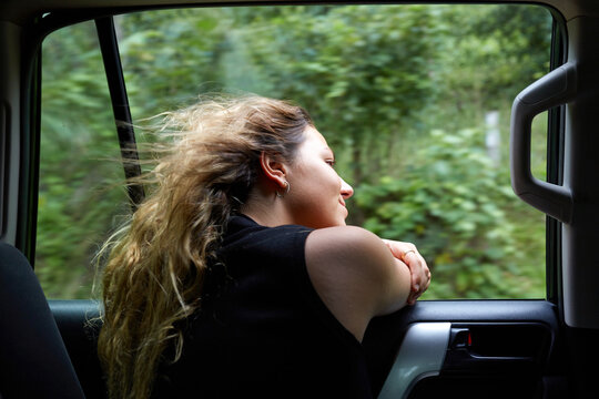 Woman enjoying Costa Rica roadtrip through lush rainforest