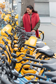 Travel woman choosing shared bicycle in Beijing, China