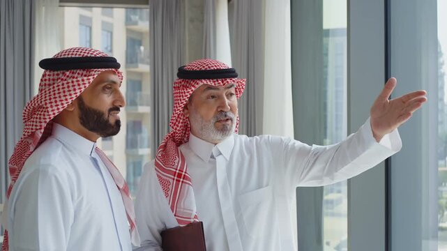 Emirati businessmen having professional discussion in office studio