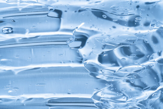 Blue transparent gel smear texture with glossy bubbles