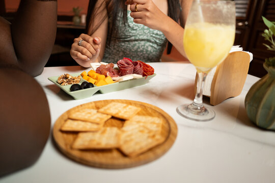 Venezuelan and Dominican couple sharing tapas at cafe