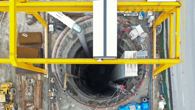 Aerial view of deep excavation shaft at construction site