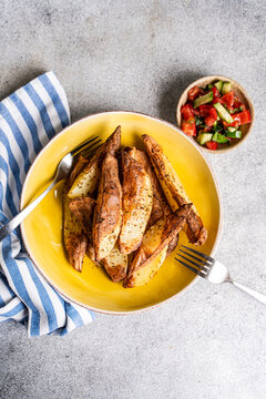 Crispy potato wedges with pico de gallo salsa