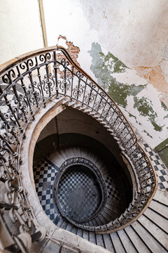 Spiral staircase in abandoned architectural setting