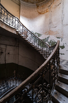 Curved iron staircase in abandoned building