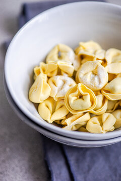 Bowl of fresh tortellini pasta with soft natural light