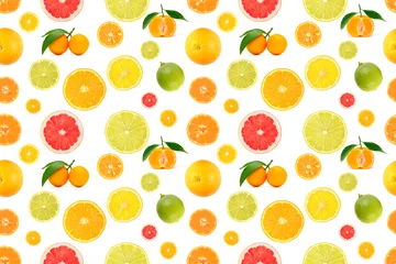 Repeating seamless pattern of mixed citrus fruits whole oranges lemons limes pink grapefruits and slices with leaves arranged on white background © Serghei V