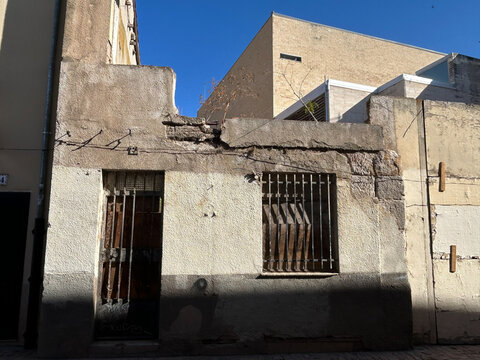 Dilapidated building facade showing urban decay and abandonment