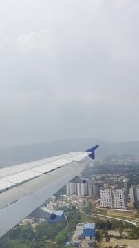 Airplane wing flying above a bright cloud layer under a dramatic blue sky, scenic aerial view from passenger window showing commercial aviation, altitude travel, freedom, journey and serene atmosphere
