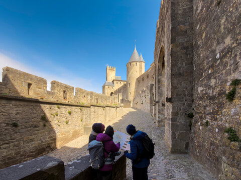 Tourists Reading a Map Inside Medieval Citadel
