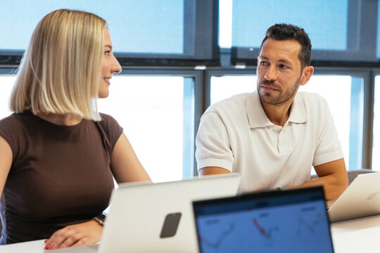 Colleagues collaborating during a business meeting in office