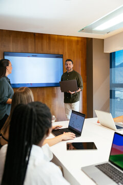 Business team discussing financial data during meeting in office
