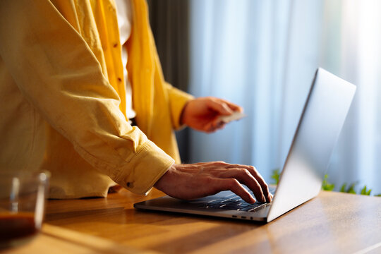 Person Making Online Payment on Laptop 