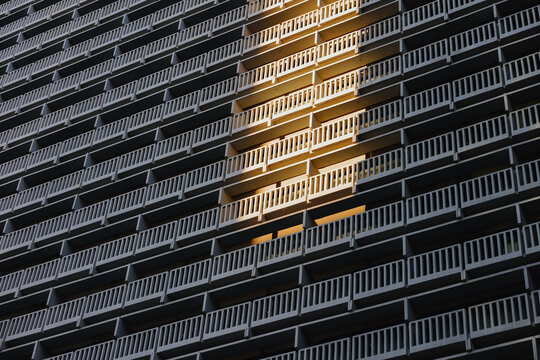 Sunlight Hits Balcony of Building in Urban Setting