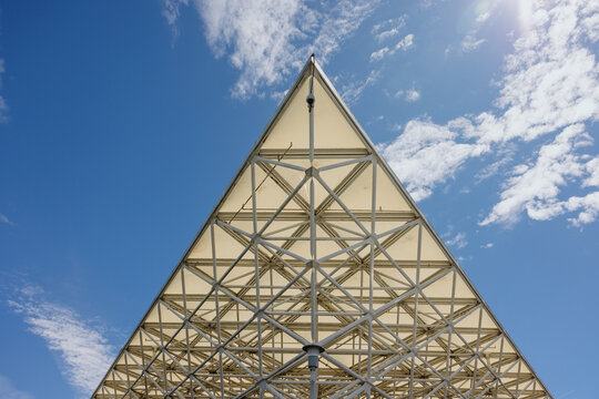 Pyramid Canopy Structure Against Blue Sky