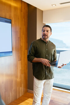 Business professional giving presentation with stock chart data