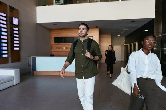 People walking in modern office lobby building