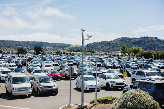 Crowded Parking Lot With Security Cameras