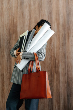 Businesswoman Struggling with Documents and Project Plans