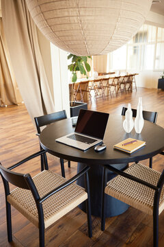Laptop with blank screen on a table