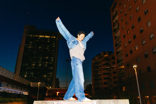 Joyful Woman with Raised Arms