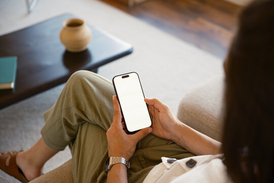 Anonymous woman browsing on smartphone
