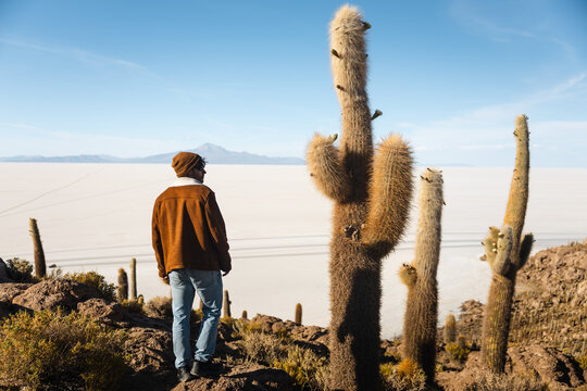 Traveler admiring panoramic views from Isla Incahuasi