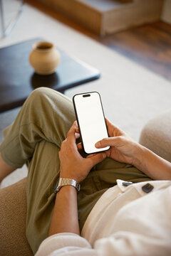 Anonymous woman browsing on smartphone