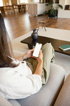 Anonymous woman browsing on smartphone