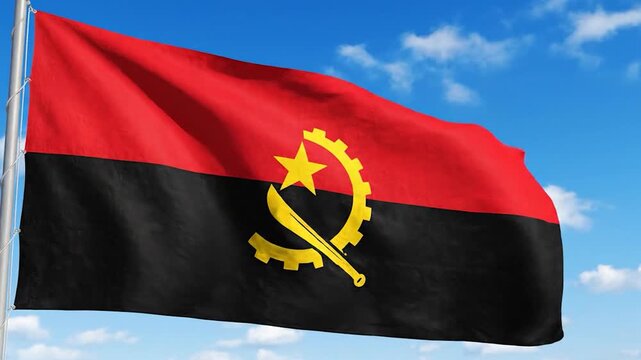 The national flag of Angola waving against a clear blue sky