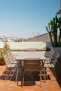 Table and chairs on a sunny terrace