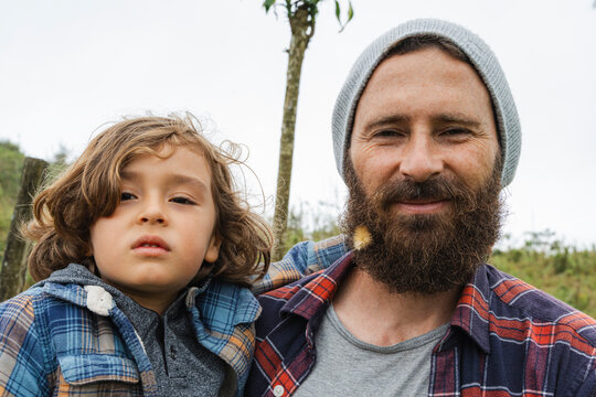 Adult spending time outdoors with offspring enjoying nature