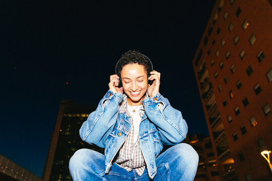 Woman Listening to Music Outdoors