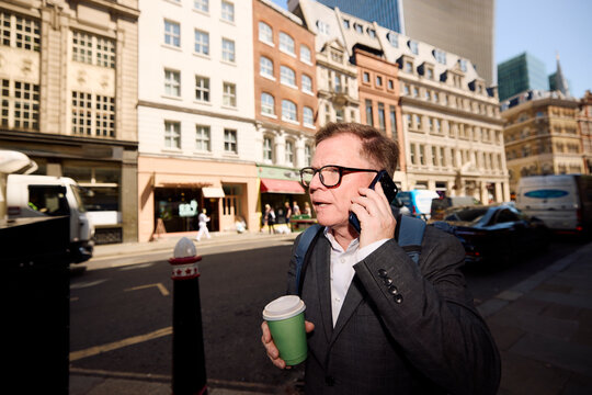 Businessman is on the phone in central London.