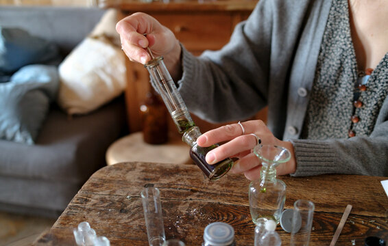 Perfumer crafting a custom fragrance in a studio workspace