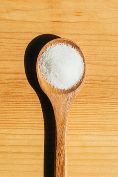 White supplement powder wooden spoon