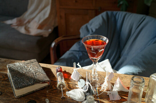 erfume bottles and glass vessels arranged on studio table in natural l
