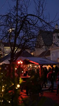 Vertical View of Christmas Market with People Walking